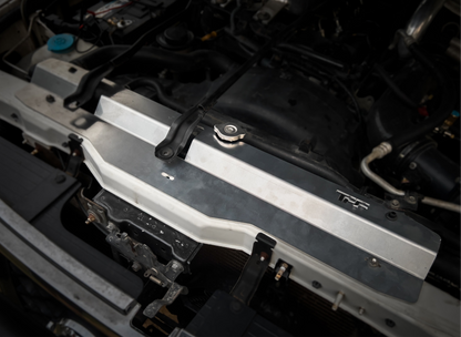 GU Patrol - silver aluminum radiator cover installed on a vehicle's engine bay.